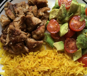 Lemon spice chicken with turmeric rice and a tomato/avocado salad